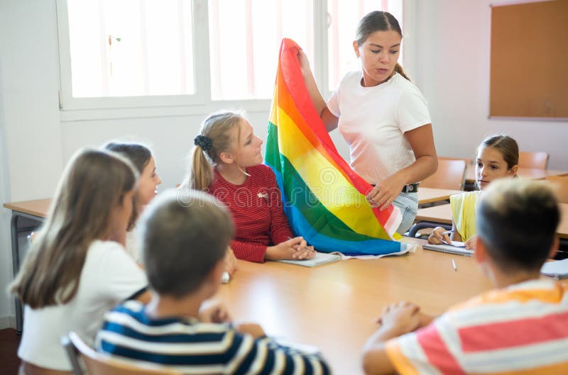 Kids attending to teacher& x27;s lecture about LGBT