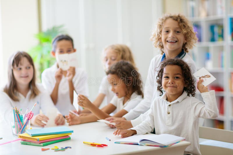 Kids Paint. Child Painting In White Sunny Study Room. Little Girl Drawing  Rainbow. School Kid Doing Art Homework. Arts And Crafts For Kids. Paint On  Children Hands. Creative Little Artist At Work.