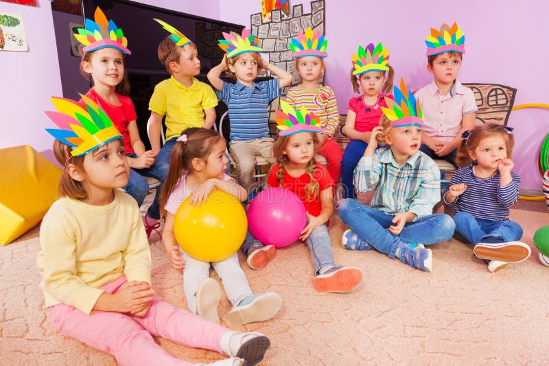 Kids boys and girls sit in circle with toys stock photography Kids boys and girls sit in circle with toys stock photography