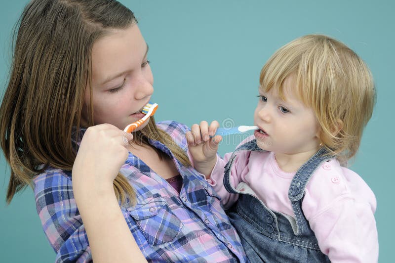 Kids brushing teeth