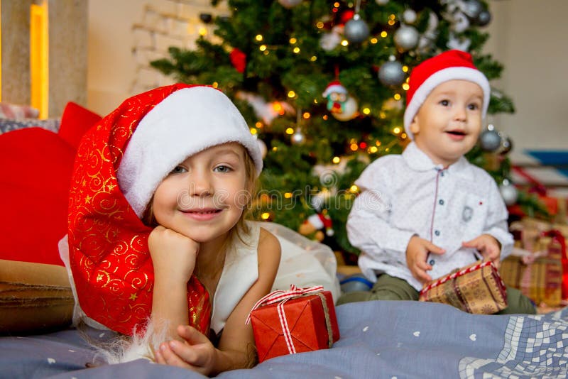 Kids celebrating christmas stock photo. Image of portrait 106635680