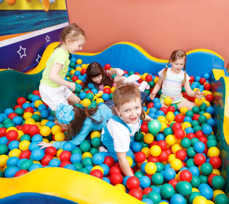 Kids in colorful balls stock photo. Image of beautiful - 13987496