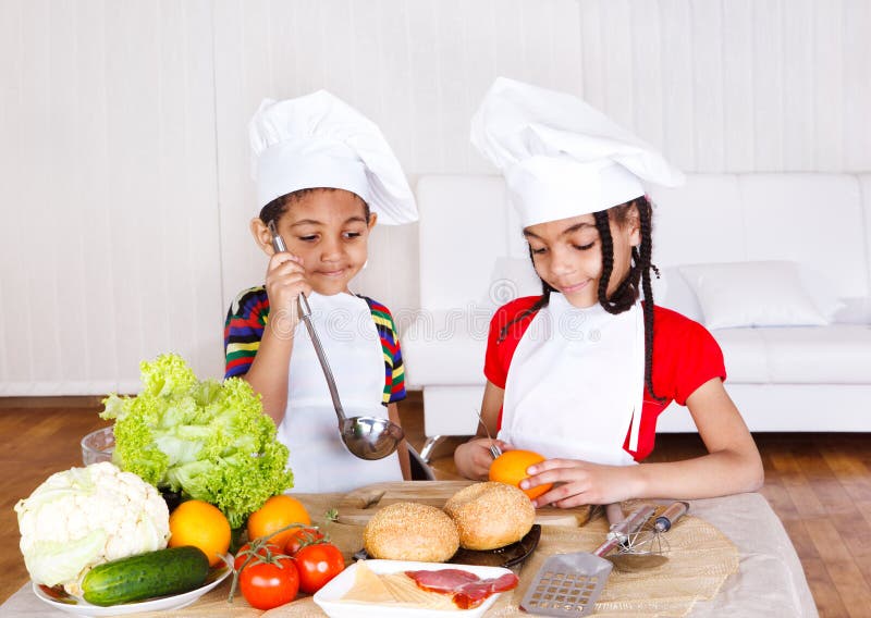 Lovely african american kids cooking