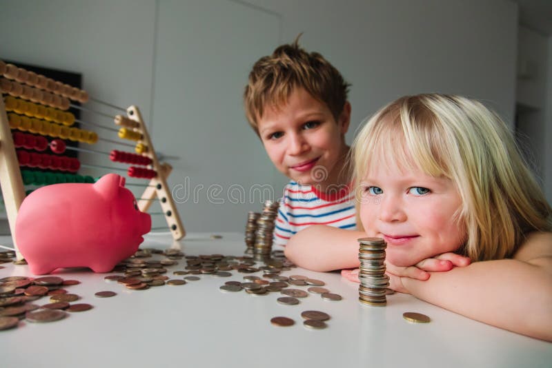Kids count and save money, girl and boy put coins into piggy bank