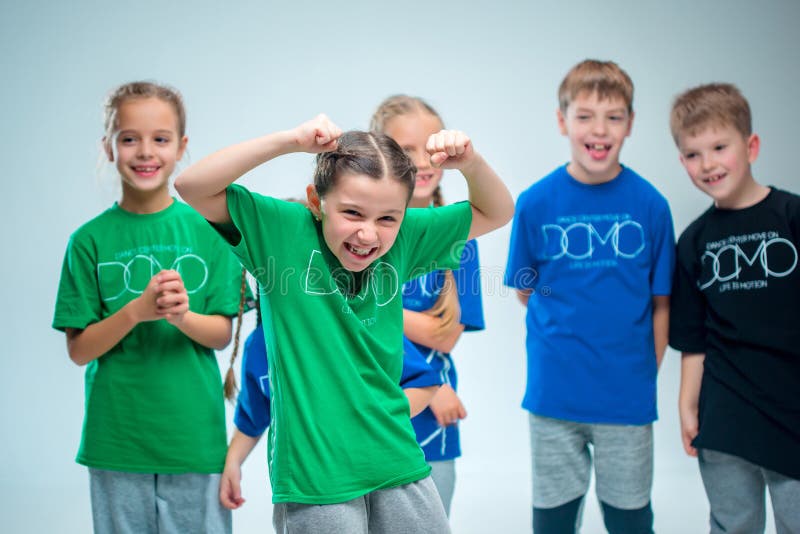 The kids dance school, ballet, hiphop, street, funky and modern dancers on gray studio background