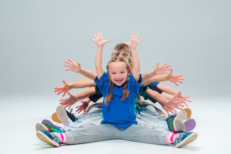 The kids dance school, ballet, hiphop, street, funky and modern dancers on gray studio background