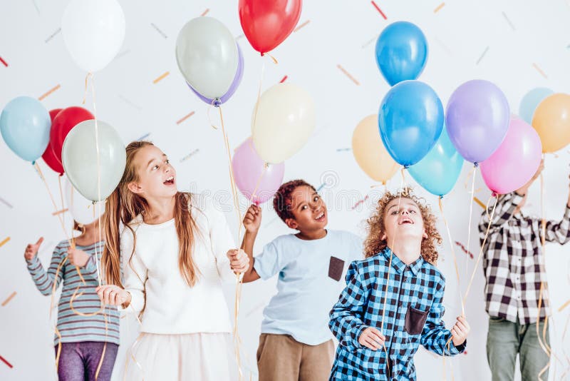 Kids dancing with balloons