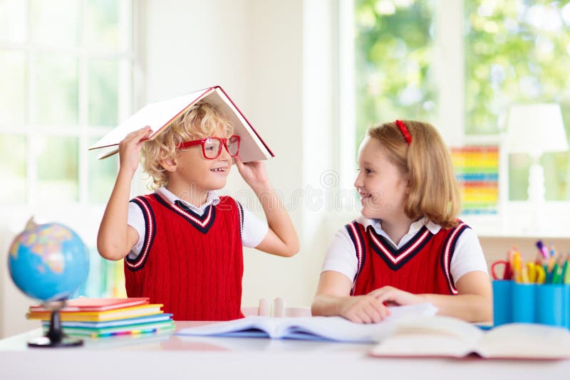 Kids go back to school. Children study and learn for preschool. Boy and girl of elementary class doing homework. Bedroom with desk, books and globe for young child. Kid learning to read and write. Kids go back to school. Children study and learn for preschool. Boy and girl of elementary class doing homework. Bedroom with desk, books and globe for young child. Kid learning to read and write