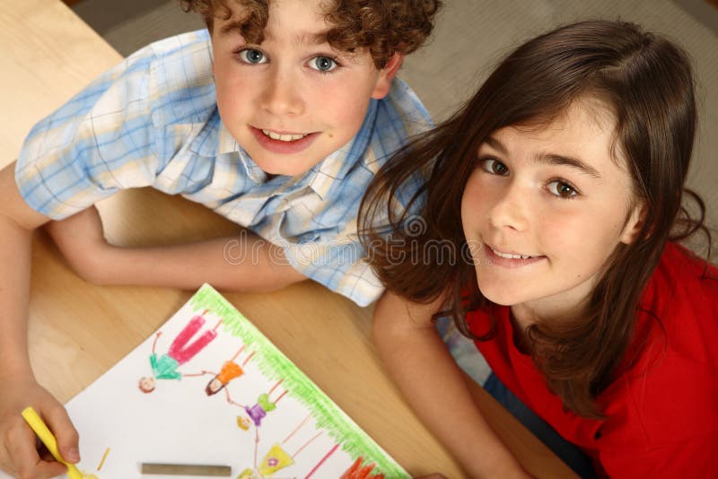 Kids drawing a happy family