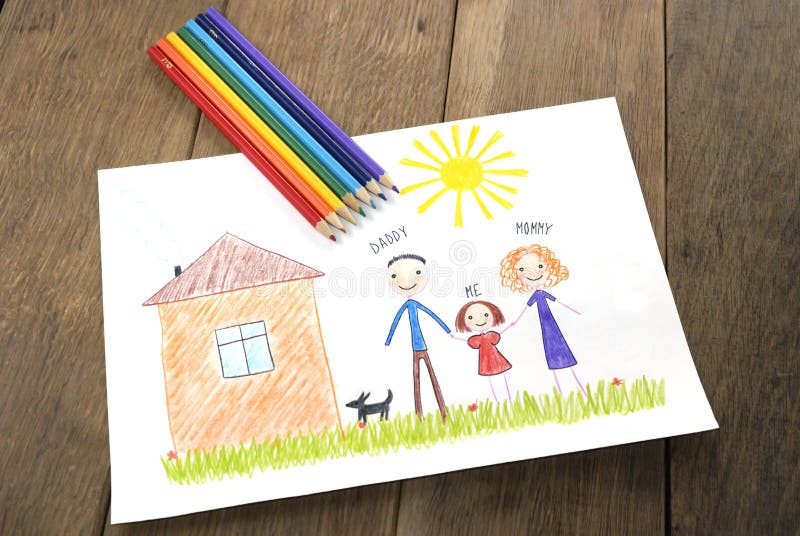 Kids drawing happy family near their house picture on the wooden table