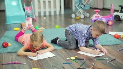 Kids Drawing with Pencils and Felt Pens at Home Stock Footage