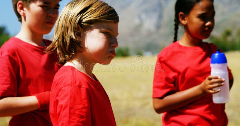 Kids drinking water in the boot camp stock video