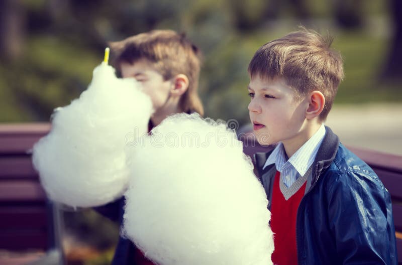 Kids eating cotton candy stock photo. Image of enjoyment 57963130