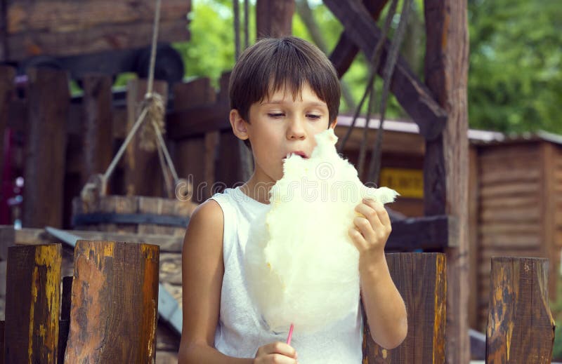 Kids eating cotton candy stock photo. Image of recreation 74292628