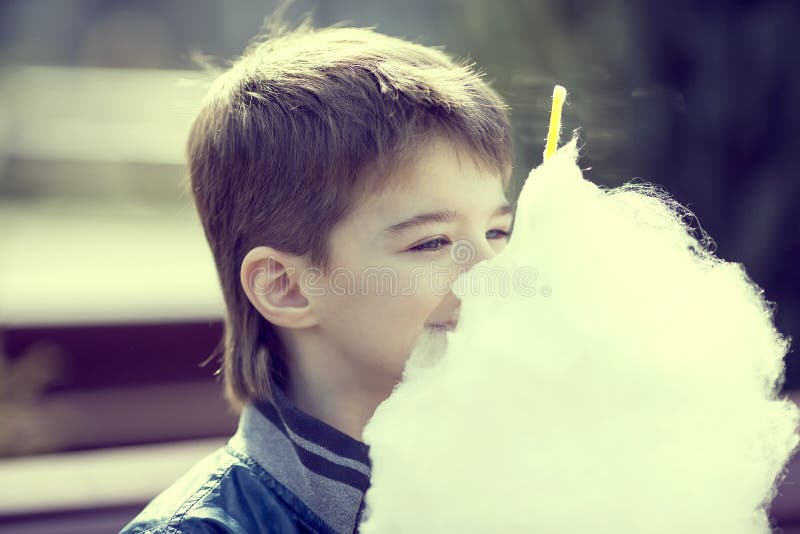 Kids eating cotton candy stock photo. Image of friendship 40603732
