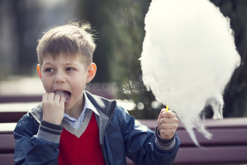 Kids eating cotton candy stock image. Image of sharing 40941491