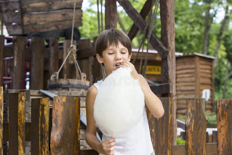 Kids eating cotton candy stock image. Image of party 75021923