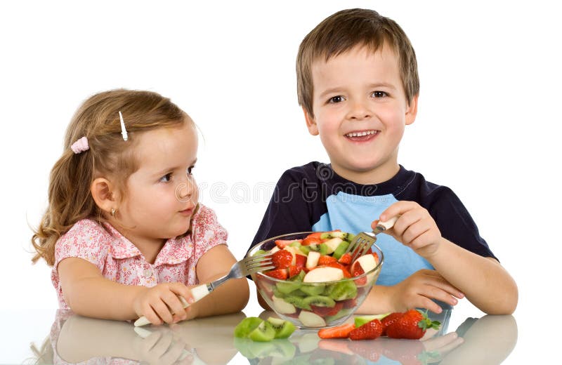 Kids eating fruit salad