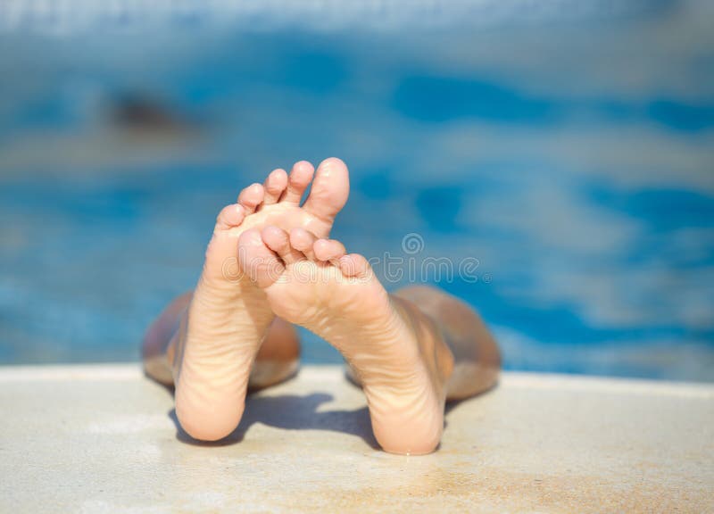 Kids feet in the pool stock image. Image of swimming 38146477
