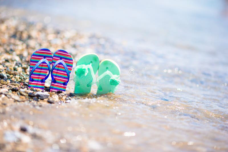 Kids Flip Flops on Beach in Front of the Sea Stock Image - Image of ...