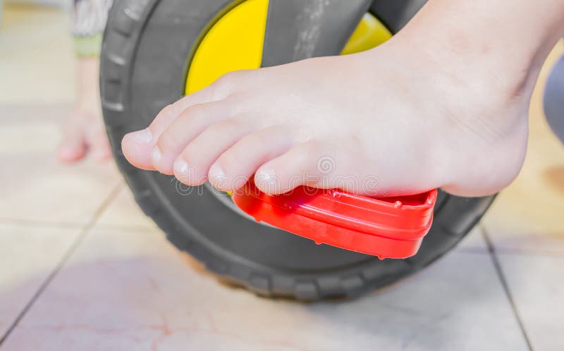 close up of kid foot on bicycle image. close up of kid foot on bicycle image.