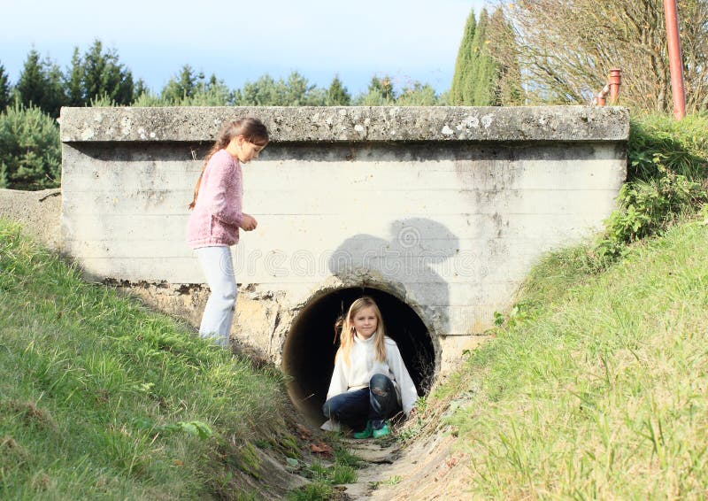 Kids - girls in canalisation stock photography Kids - girls in canalisation stock photography