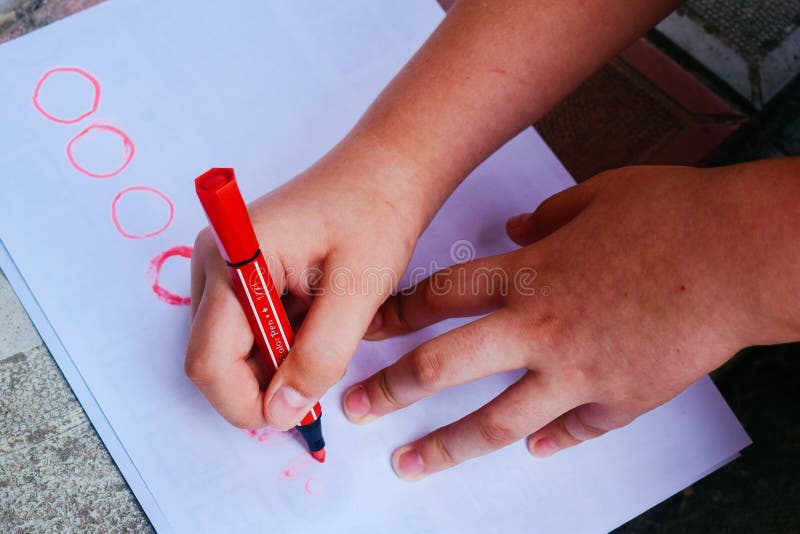 Kids Hands Drawing on a Paper Stock Image Image of paper, markers