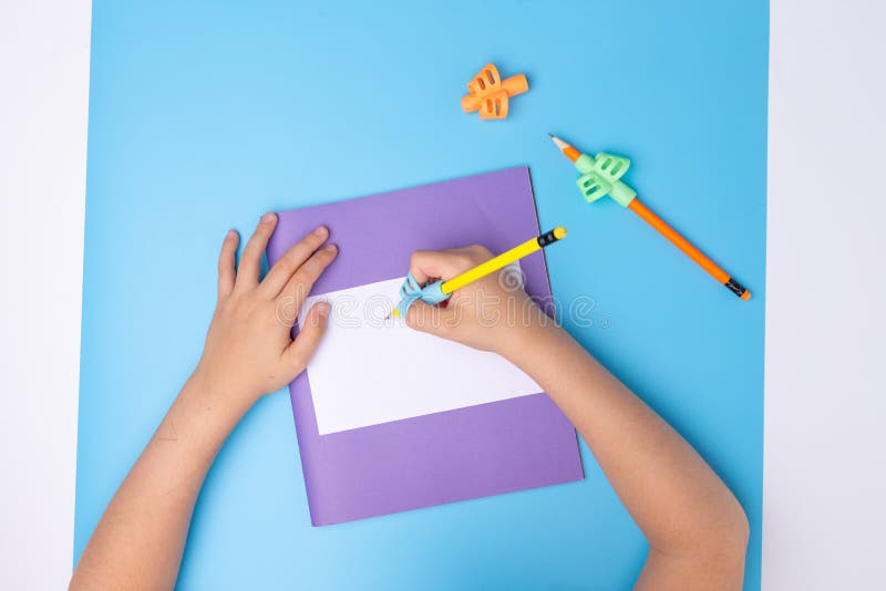 Kids hands hold two-finger grip writing tool , preschooler learning how to hold pencil