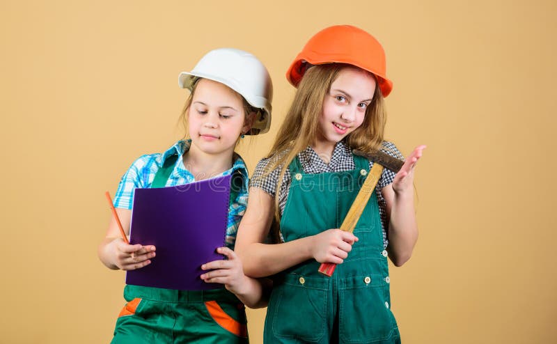 Kids happy renovating home. Home improvement activity. Kids girls with tools planning renovation. Family remodeling house. Children sisters renovation their room. Control renovation process.