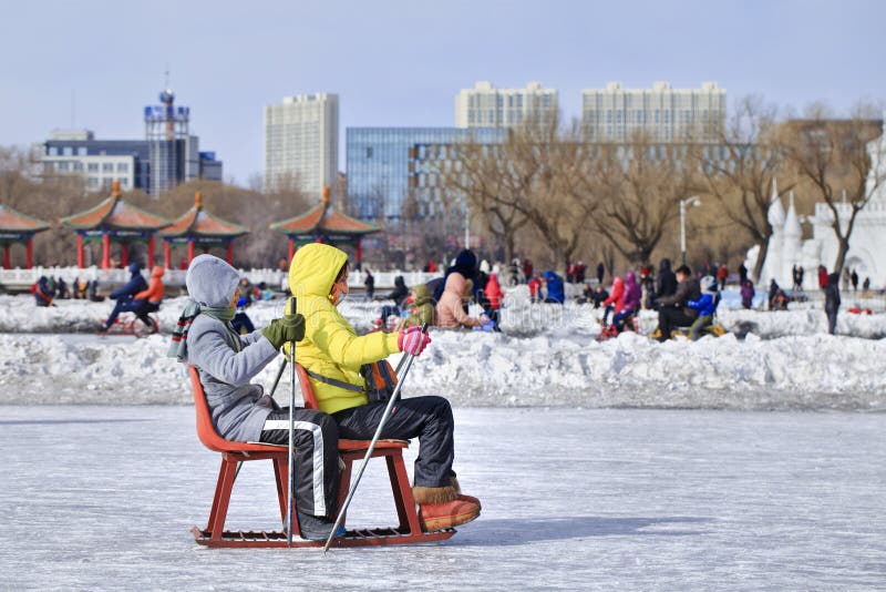 Kids Having Fun with Sledging on Ice in Nanhu Park, Changchun, China  Editorial Image - Image of blue, apartment: 91566250