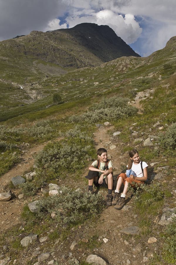 Kids hiking in mountains, Norway