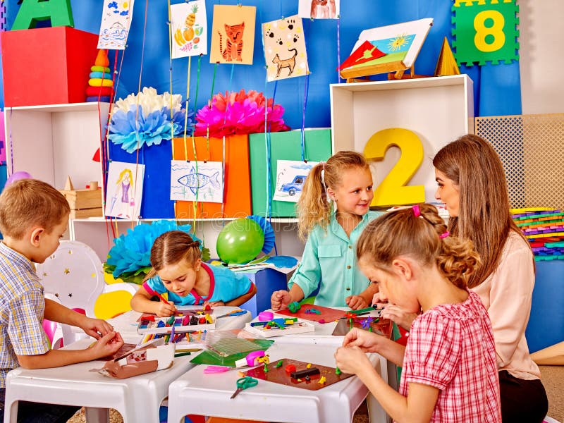 Kids Holding Colored Paper on Table in Stock Image - Image of painting ...