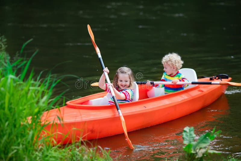 Kids kayaking in summer sport camp royalty free stock photo Kids kayaking in summer sport camp royalty free stock photo