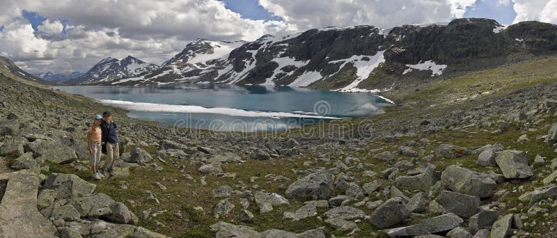 Kids by lake with floes on surface, Norway