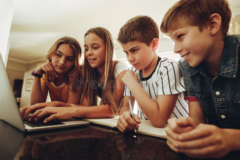 Kids learning together on a laptop stock images Kids learning together on a laptop stock images
