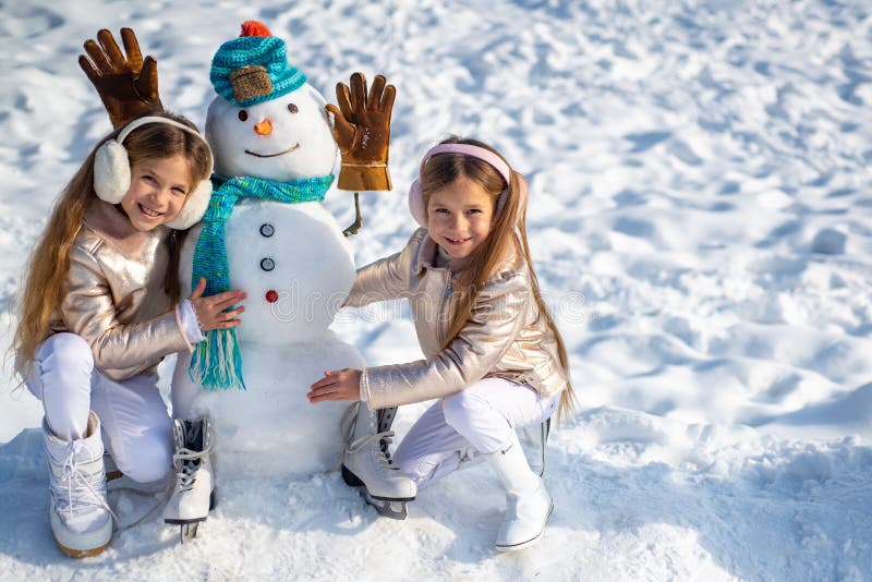 Kids Make Snowman on White Snow Background. Happy Children Playing with a  Snowman on a Snowy Winter Walk. Stock Photo - Image of holiday, event:  166284752