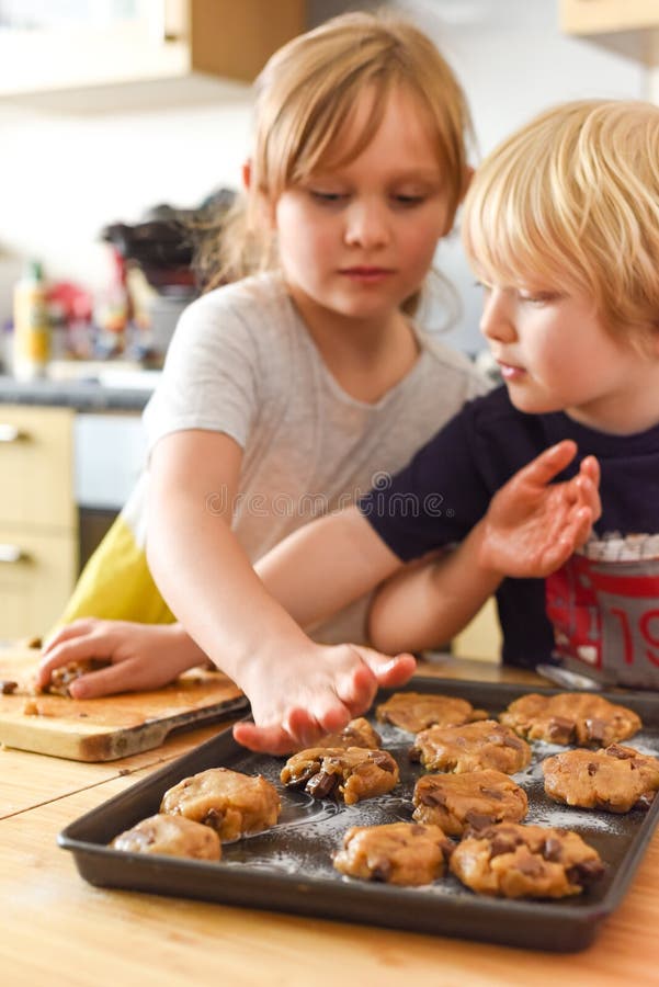 Kids Making Cookies in Kitchen Placing Dough on Tray for Cooking at