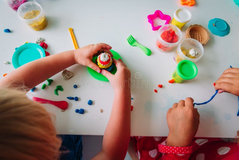Kids Play with Clay Molding Shapes, Learning through Play Stock Photo