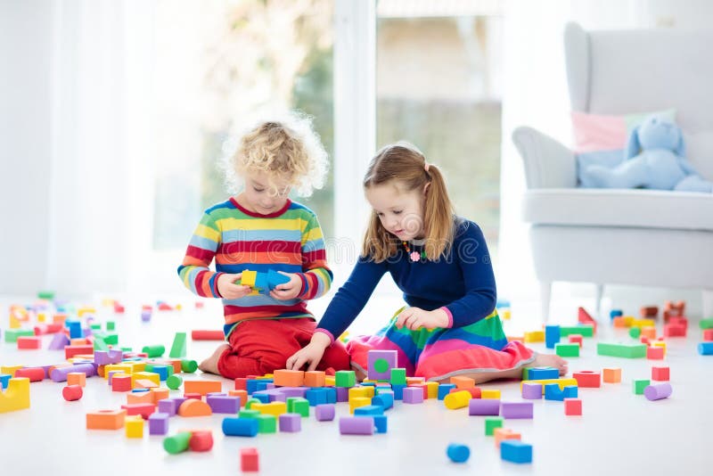 Kids play with toy blocks. Toys for children. stock photo Kids play with toy blocks. Toys for children. stock photo