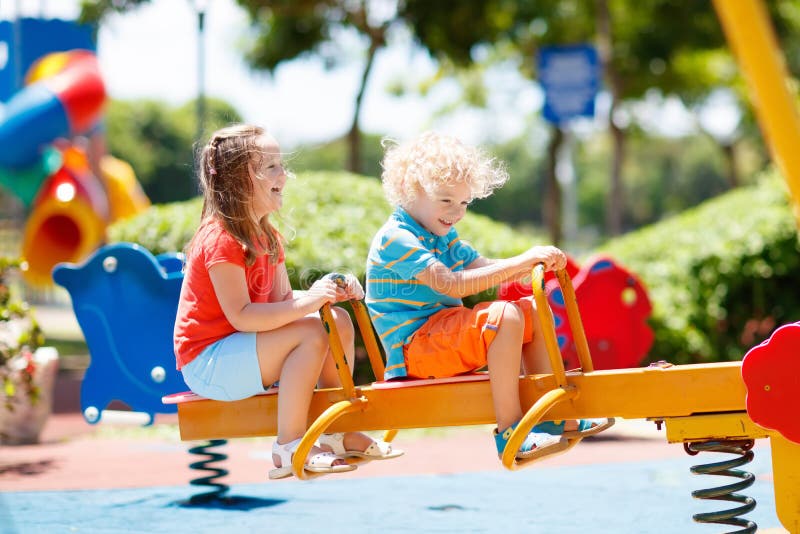 Kids on playground. Children play in summer park.