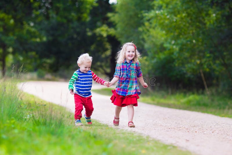 Kids playing in autumn park stock photos Kids playing in autumn park stock photos