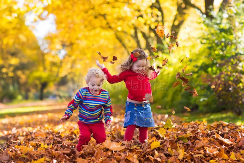 Kids playing in autumn park