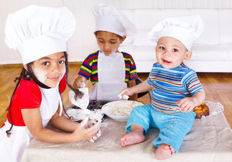 Three african american kids playing with flour
