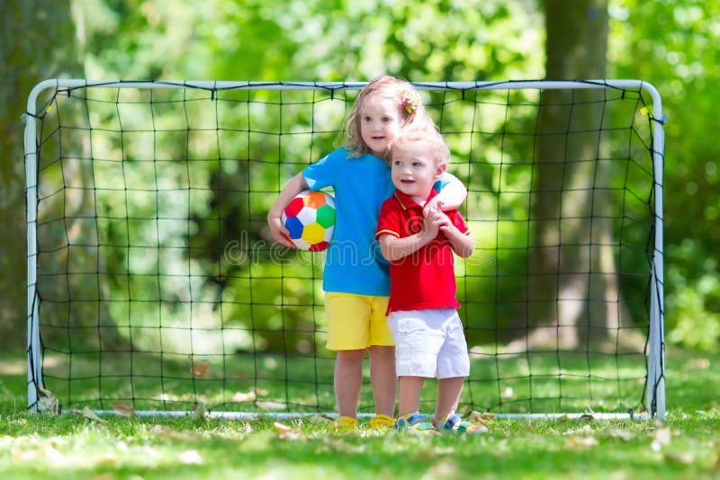 Kids playing football in school yard