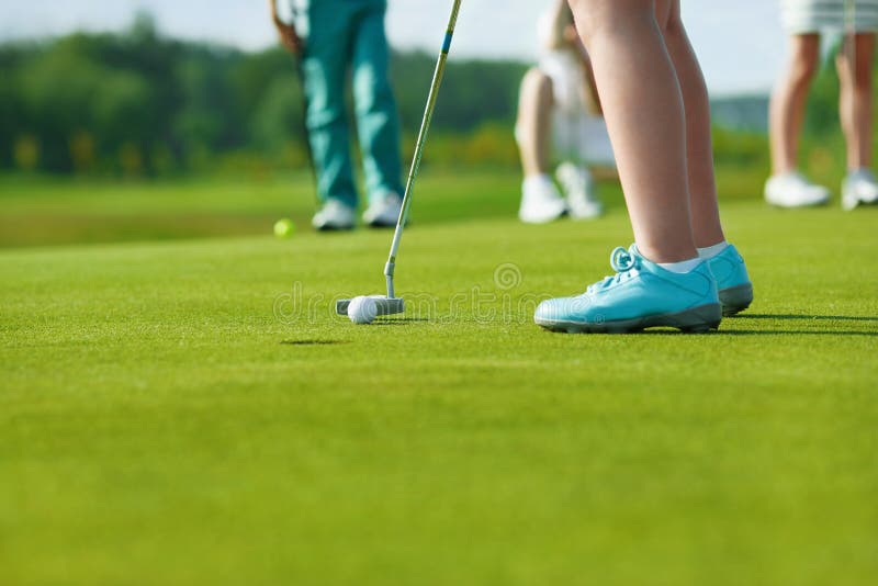 Kids playing golf