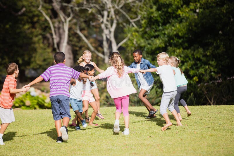 Kids Playing Together during a Sunny Day Stock Photo Image of