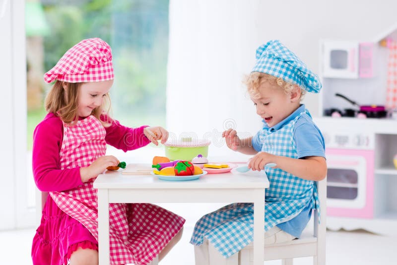 Kids Playing with Toy Kitchen Stock Photo - Image of brother, friends: 73345632