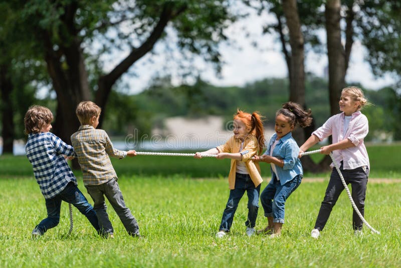 Kids-playing-tug-war-side-view-beautiful-little-multiethnic-park-103918666. Jpg