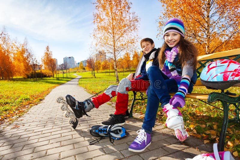 Kids Putting On Roller Blades Stock Image - Image of lifestyle, fall
