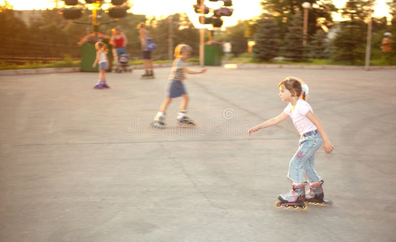 Kids ride on roller skates on skate